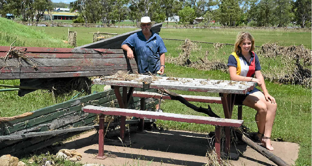 TOP EFFORT: Warwick Hockey Association groundsman Darryl Gillam and grand-daughter Ayden Gillam near some of the floor rubbish in January, 2013. TOP EFFORT: Warwick Hockey Association groundsman Darryl Gillam and grand-daughter Ayden Gillam near some of the floor rubbish in January, 2013.
