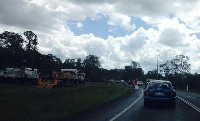 Stop-go workers are directing traffic through the Saltwater Creek bridge area with roadworks under way. Stop-go workers are directing traffic through the Saltwater Creek bridge area with roadworks under way.