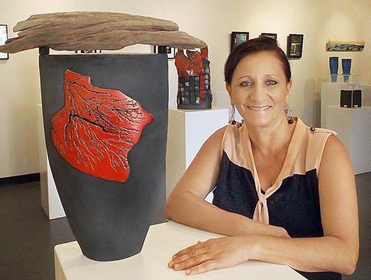 Artist Ariella Anderson with one of her favourite pieces from her exhibition at Gatakers Artspace. Artist Ariella Anderson with one of her favourite pieces from her exhibition at Gatakers Artspace.