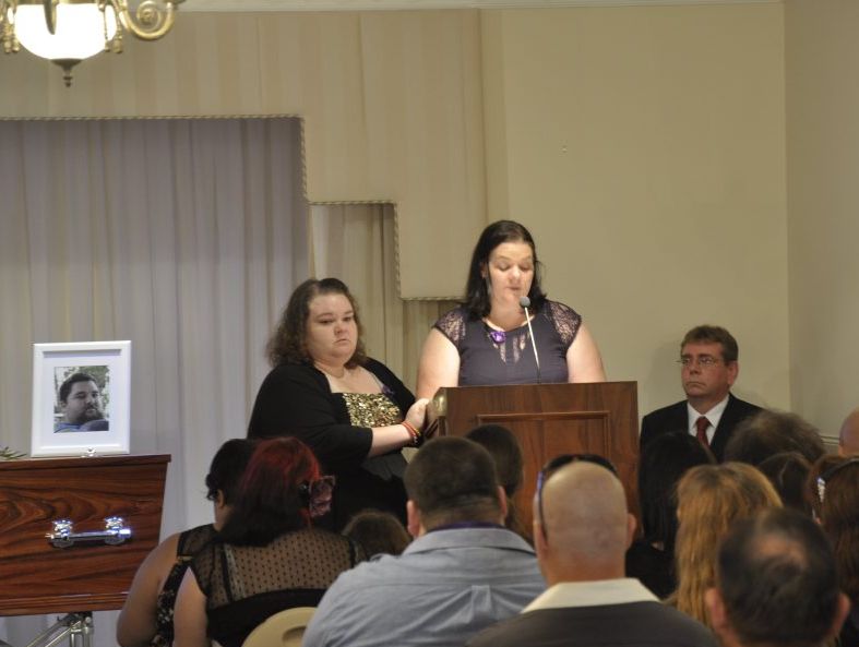 Louella Clarke is supported by her sister Louise Walker (left) while speaking at their brother Luke Walker's funeral. Luke was killed in a crash on March 27 at the intersection of Ruthven and James Sts. Louella Clarke is supported by her sister Louise Walker (left) while speaking at their brother Luke Walker's funeral. Luke was killed in a crash on March 27 at the intersection of Ruthven and James Sts.