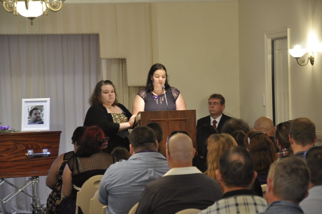 Louella Clarke is supported by her sister Louise Walker (left) while speaking at their brother Luke Walker's funeral. Luke was killed in a crash on March 27 at the intersection of Ruthven and James Sts. Louella Clarke is supported by her sister Louise Walker (left) while speaking at their brother Luke Walker's funeral. Luke was killed in a crash on March 27 at the intersection of Ruthven and James Sts.
