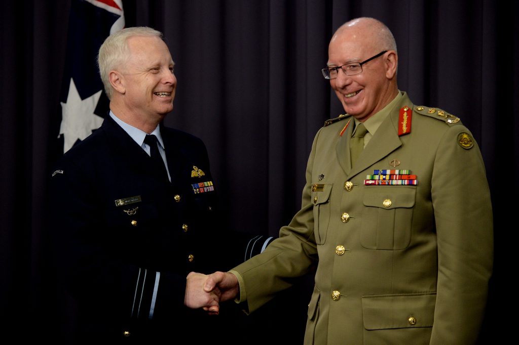 The new Chief of the Defence Force Air Marshal Mark Binskin (left) shakes hands with retiring CDF General David Hurley during a press conference in Canberra, Friday, April 4, 2014. Prime Minister Tony Abbott annouced the changes today. (AAP Image/Alan Porritt) NO ARCHIVING The new Chief of the Defence Force Air Marshal Mark Binskin (left) shakes hands with retiring CDF General David Hurley during a press conference in Canberra, Friday, April 4, 2014. Prime Minister Tony Abbott annouced the changes today. (AAP Image/Alan Porritt) NO ARCHIVING