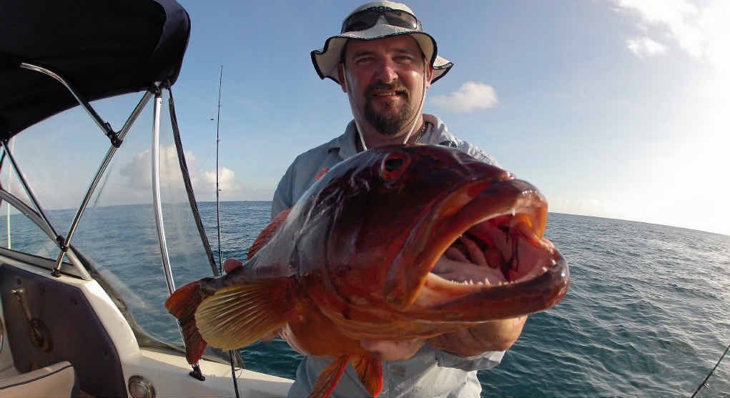 FAT FISH: Pat Laws holding up a very fat coral trout caught last Sunday morning out on the reef. FAT FISH: Pat Laws holding up a very fat coral trout caught last Sunday morning out on the reef.
