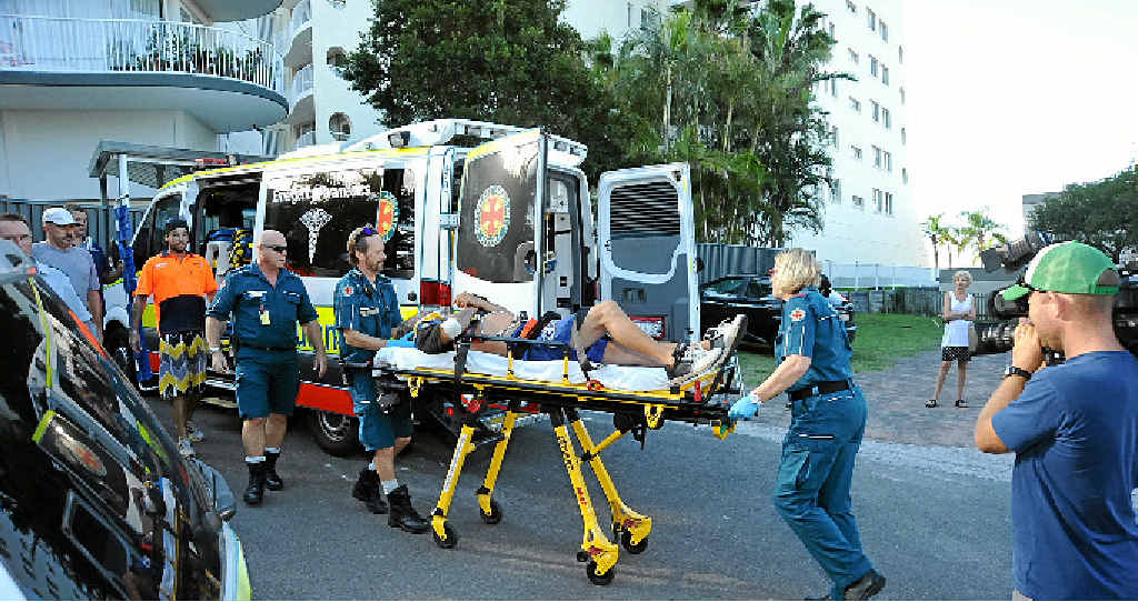 ACCIDENT SCENE: Adam Wegner is wheeled into an ambulance after falling four floors from a holiday unit. ACCIDENT SCENE: Adam Wegner is wheeled into an ambulance after falling four floors from a holiday unit.