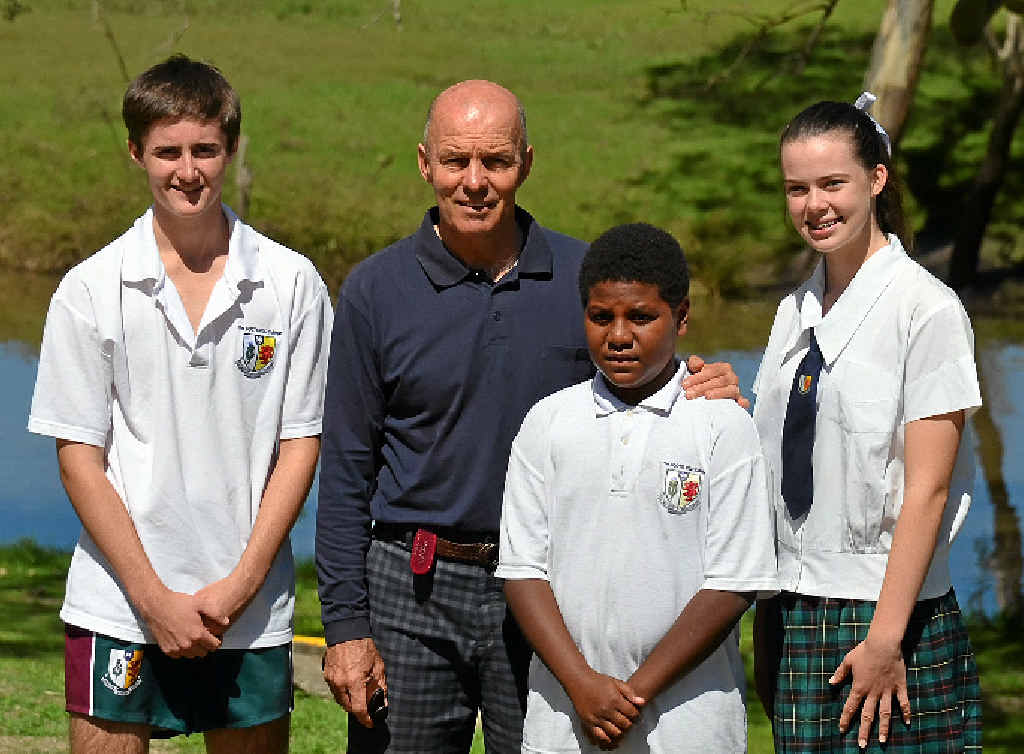 SAYING GOODBYE: Scots PGC Teacher Geoff Richardson with students Pat Bourke, Lachlan Titus and Emily Bradfield. SAYING GOODBYE: Scots PGC Teacher Geoff Richardson with students Pat Bourke, Lachlan Titus and Emily Bradfield.