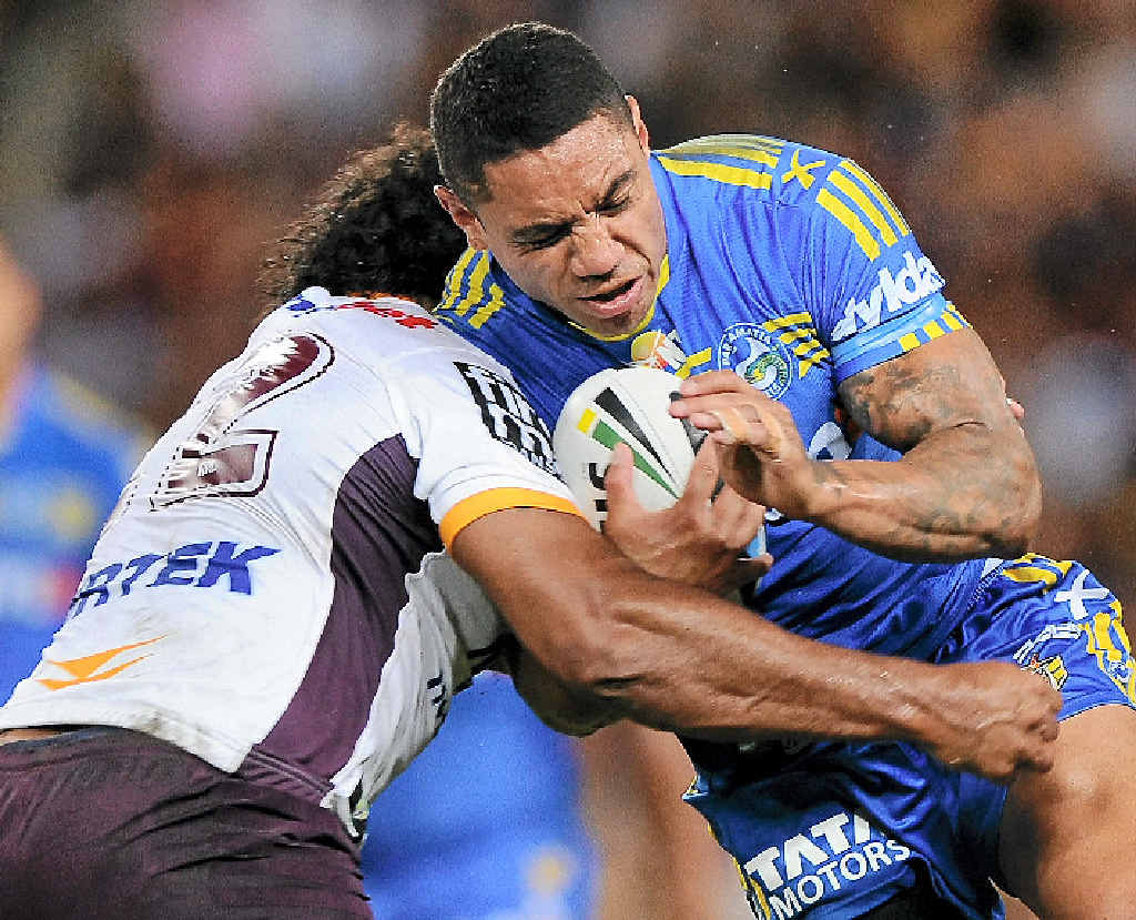 CRUNCH TIME: Willie Tonga of the Eels is tackled by a Brisbane Broncos player at Suncorp Stadium last night. CRUNCH TIME: Willie Tonga of the Eels is tackled by a Brisbane Broncos player at Suncorp Stadium last night.