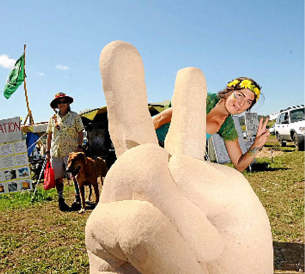Tai Dwyer of Mullumbimby with a peace sign statue at the CSG camp on Saturday. Tai Dwyer of Mullumbimby with a peace sign statue at the CSG camp on Saturday.