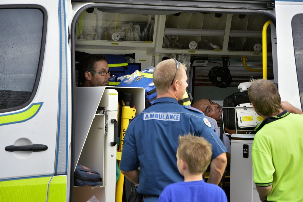 Glen Harper (far left) and Tim Collins (lying down) say they were struck by lightning during Sunday's large storm. Both men were outside on Mr Collins' patio at the time. Glen Harper (far left) and Tim Collins (lying down) say they were struck by lightning during Sunday's large storm. Both men were outside on Mr Collins' patio at the time.