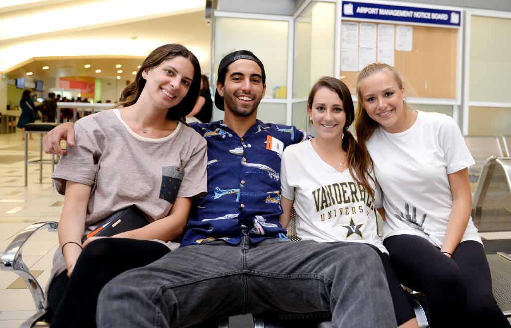LET’S FLY JETSTAR: American exchange students Jamie Merkrebs, John Iaia, Jessica Nacht and Carly Levine ready for boarding after their flight to Sydney made an unexpected stop in Rockhampton on Sunday night. Right: The plane’s flight path from Cairns to Rockhampton.