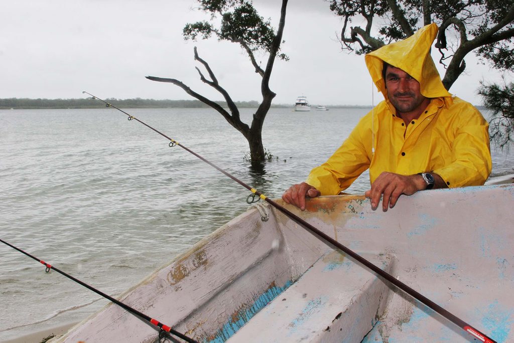 RAIN DROPS: Wet weather did not stop Mark Shipman fishing at Banksia Beach RAIN DROPS: Wet weather did not stop Mark Shipman fishing at Banksia Beach