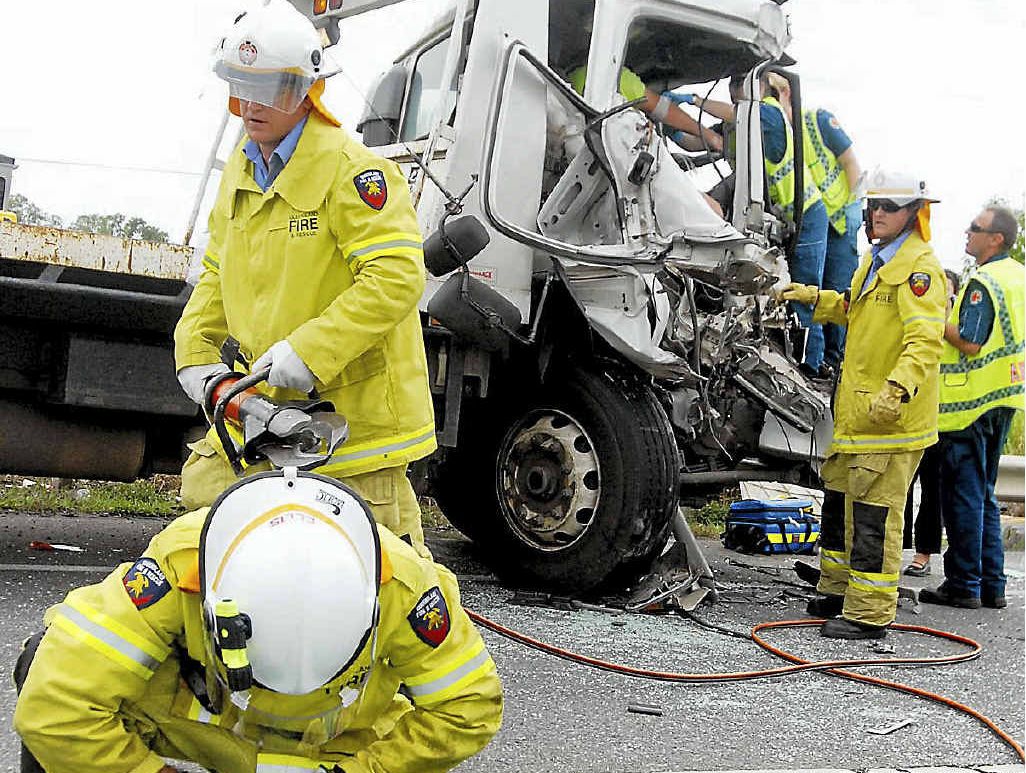 Firefighters work to free James Redell Walters from his truck after the crash at Bakers Creek. Firefighters work to free James Redell Walters from his truck after the crash at Bakers Creek.