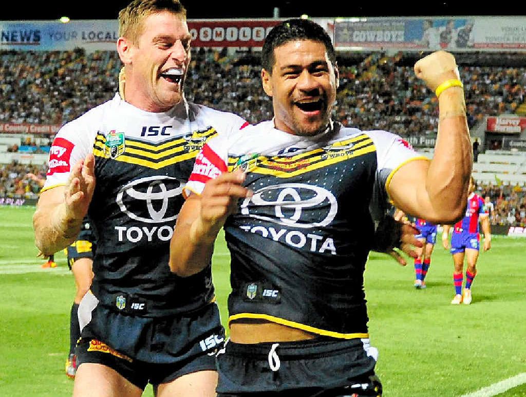 Cowboys winger Matthew Wright (right) celebrates with Brent Tate after he scored a try against the Newcastle Knights at 1300SMILES Stadium in Townsville last night. Cowboys winger Matthew Wright (right) celebrates with Brent Tate after he scored a try against the Newcastle Knights at 1300SMILES Stadium in Townsville last night.