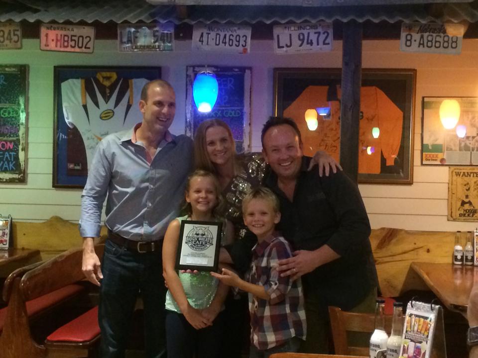 Hog's Breath Gladstone owner Alex Staines (right) celebrates his cafe's opening with family and friends. Hog's Breath Gladstone owner Alex Staines (right) celebrates his cafe's opening with family and friends.