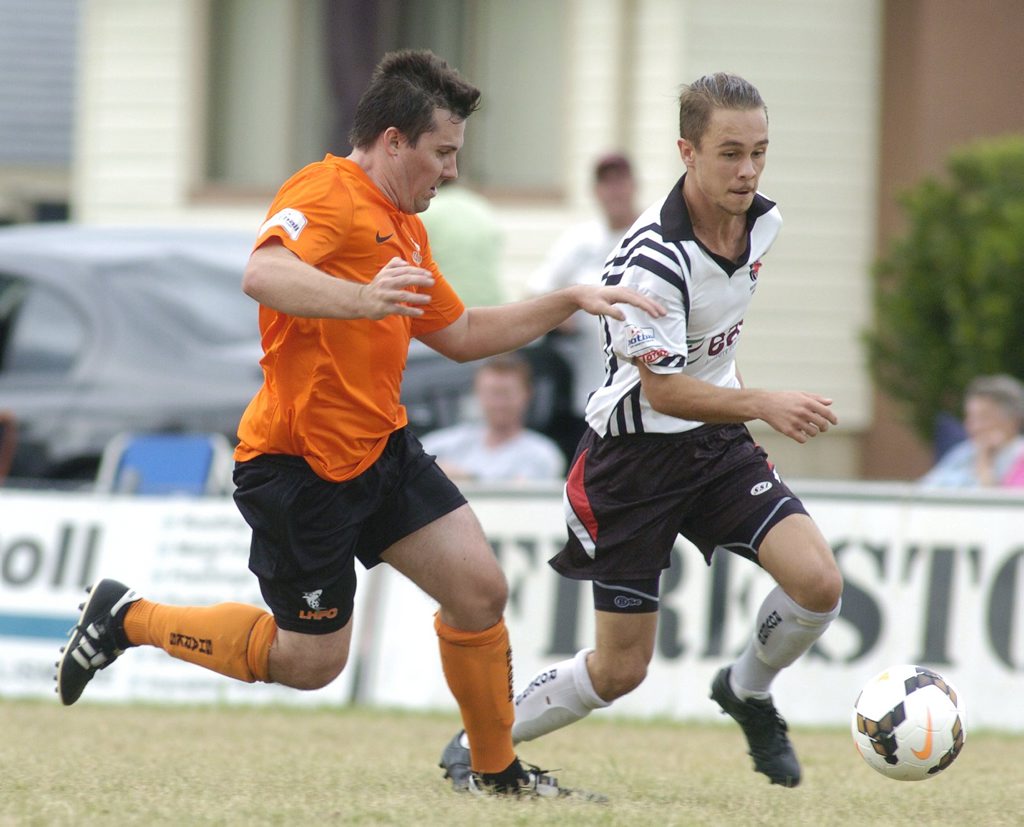 Richmond Rovers attacker Andrew Casagrande (right) tries to outrun Lennox Head Sharks defender Shaun Gillepsie during Football FNC clash. Richmond Rovers attacker Andrew Casagrande (right) tries to outrun Lennox Head Sharks defender Shaun Gillepsie during Football FNC clash.