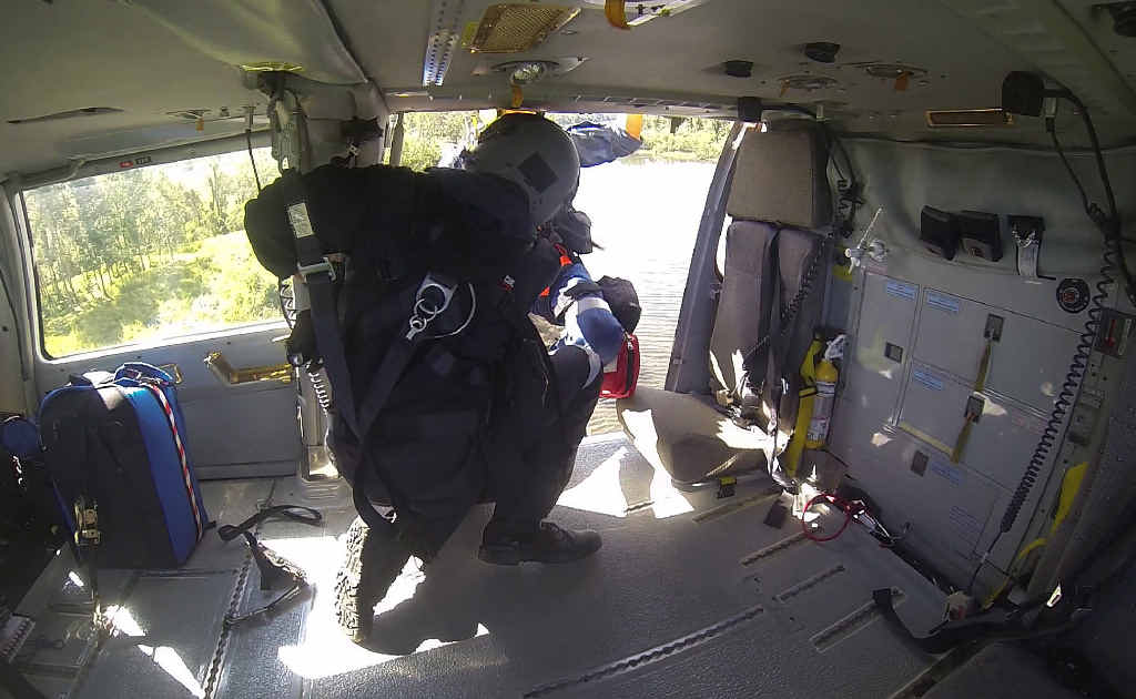 CRASH SCENE: Crew winch a plane crash survivor on board the rescue chopper on Saturday. CRASH SCENE: Crew winch a plane crash survivor on board the rescue chopper on Saturday.