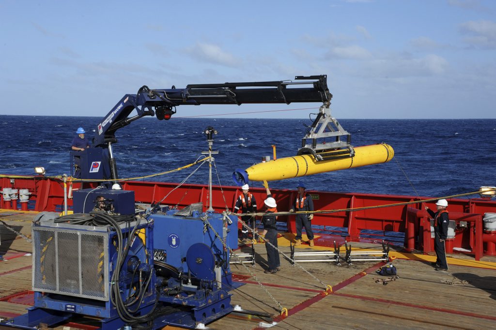 FILE - In this April 1, 2014 file photo, provided by the U.S. Navy, the Bluefin 21 autonomous sub is hoisted back on board the Australian Defense Vessel Ocean Shield after successful buoyancy testing in the Indian Ocean, as search efforts continue for missing Malaysia Airlines Flight 370. FILE - In this April 1, 2014 file photo, provided by the U.S. Navy, the Bluefin 21 autonomous sub is hoisted back on board the Australian Defense Vessel Ocean Shield after successful buoyancy testing in the Indian Ocean, as search efforts continue for missing Malaysia Airlines Flight 370.