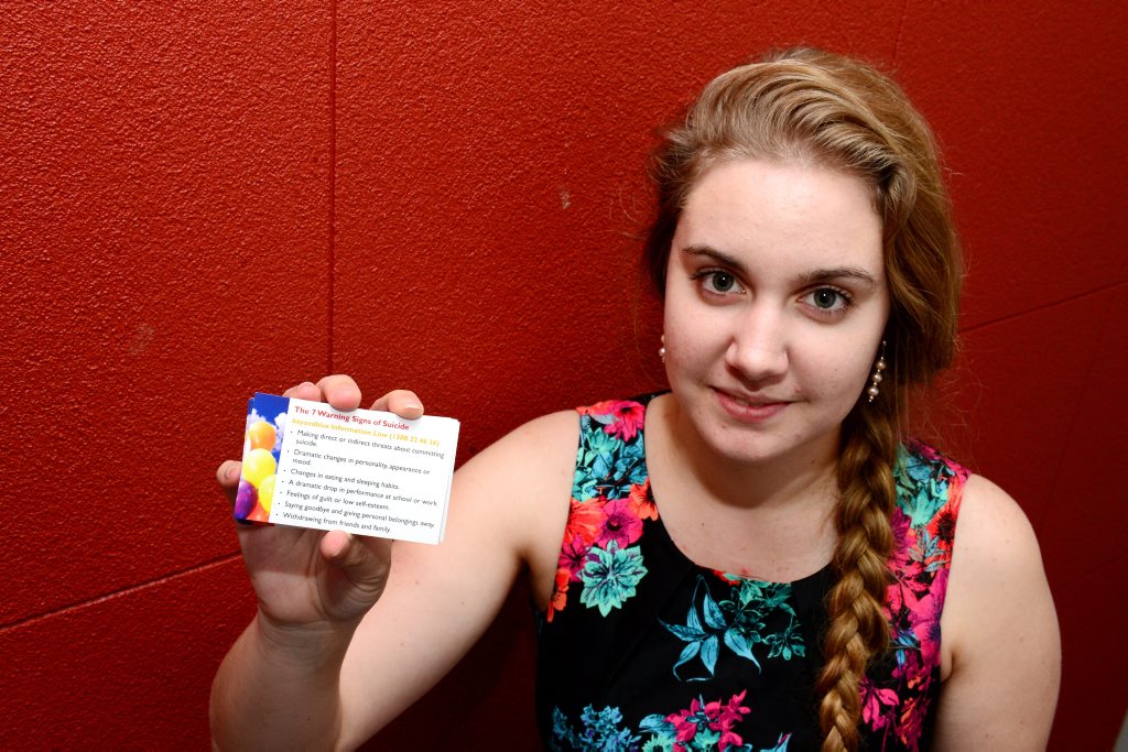 Tiana Ruckert is promoting a card featuring the seven signs of suicide, a project that has also been turned into a video. Photo Sharyn O'Neill / The Morning Bulletin Tiana Ruckert is promoting a card featuring the seven signs of suicide, a project that has also been turned into a video. Photo Sharyn O'Neill / The Morning Bulletin