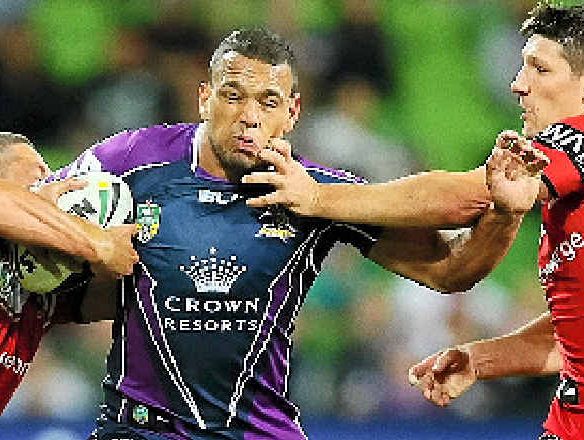 Will Chambers of the Storm is tackled by Gerard Beale (left) and Gareth Widdop of the Dragons at AAMI Park last night. Will Chambers of the Storm is tackled by Gerard Beale (left) and Gareth Widdop of the Dragons at AAMI Park last night.