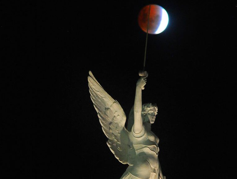 The blood moon of April 15 passes over the winged figure of victory gracing the cenotaph at Queens Park in Maryborough. The blood moon of April 15 passes over the winged figure of victory gracing the cenotaph at Queens Park in Maryborough.