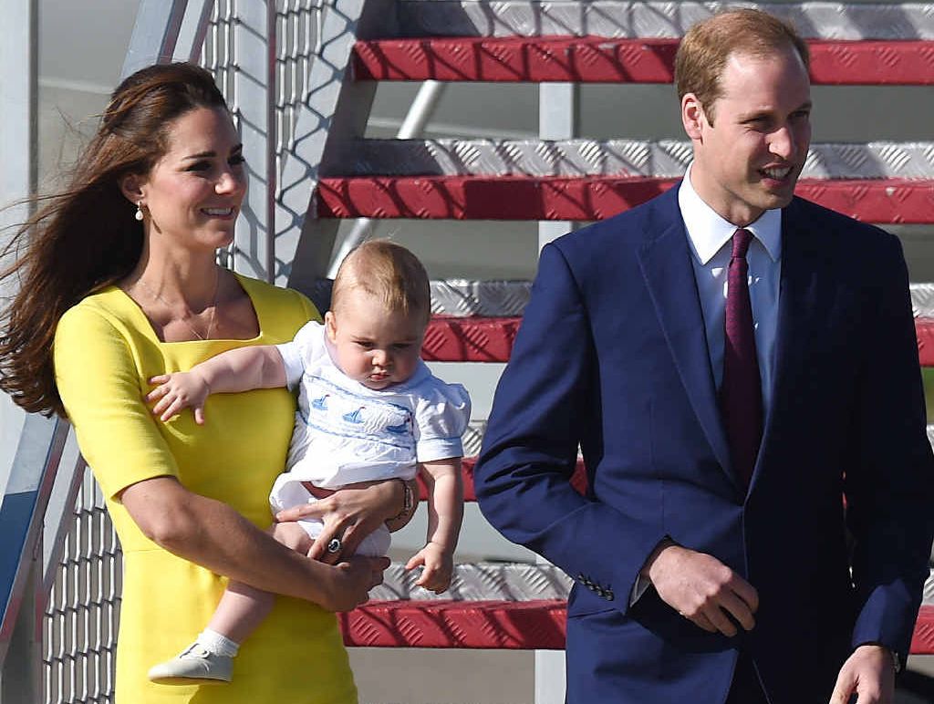 ON THEIR WAY HERE: The Duke and Duchess of Cambridge, Prince William, Catherine, and Prince George are greeted on their arrival in Sydney yesterday.