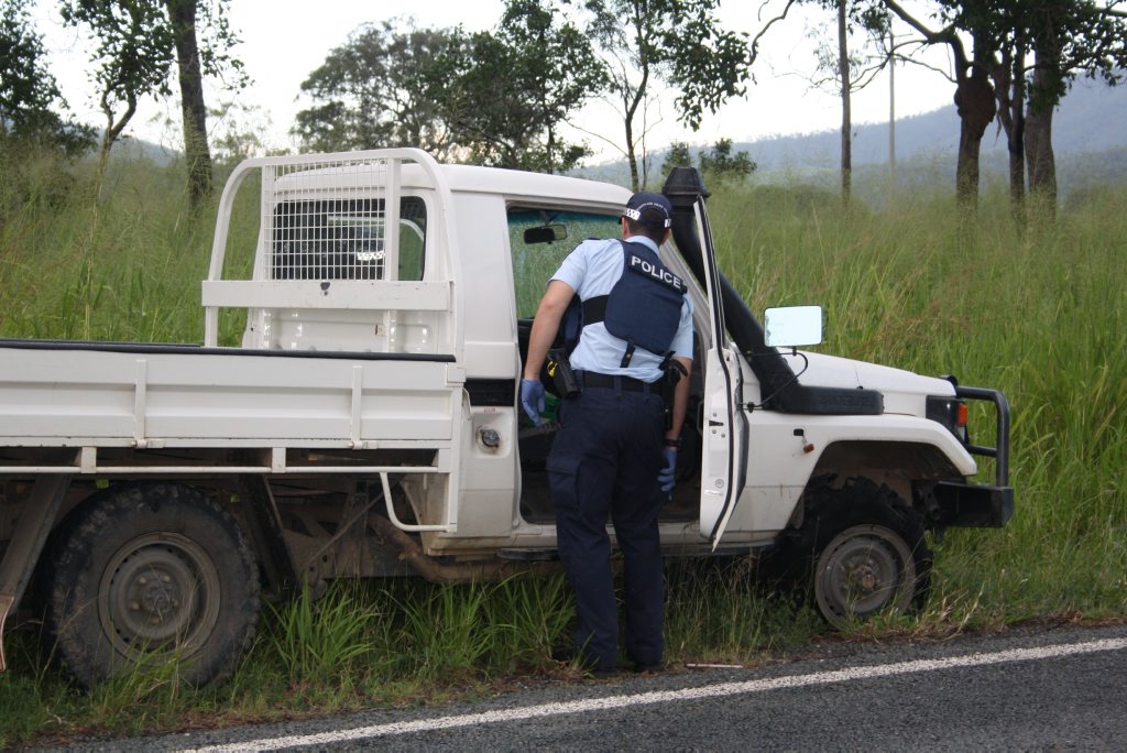 A police officer inspects the stolen vehicle the Rockhampton prison escapees used. Photo Austin King / The Morning Bulletin A police officer inspects the stolen vehicle the Rockhampton prison escapees used. Photo Austin King / The Morning Bulletin