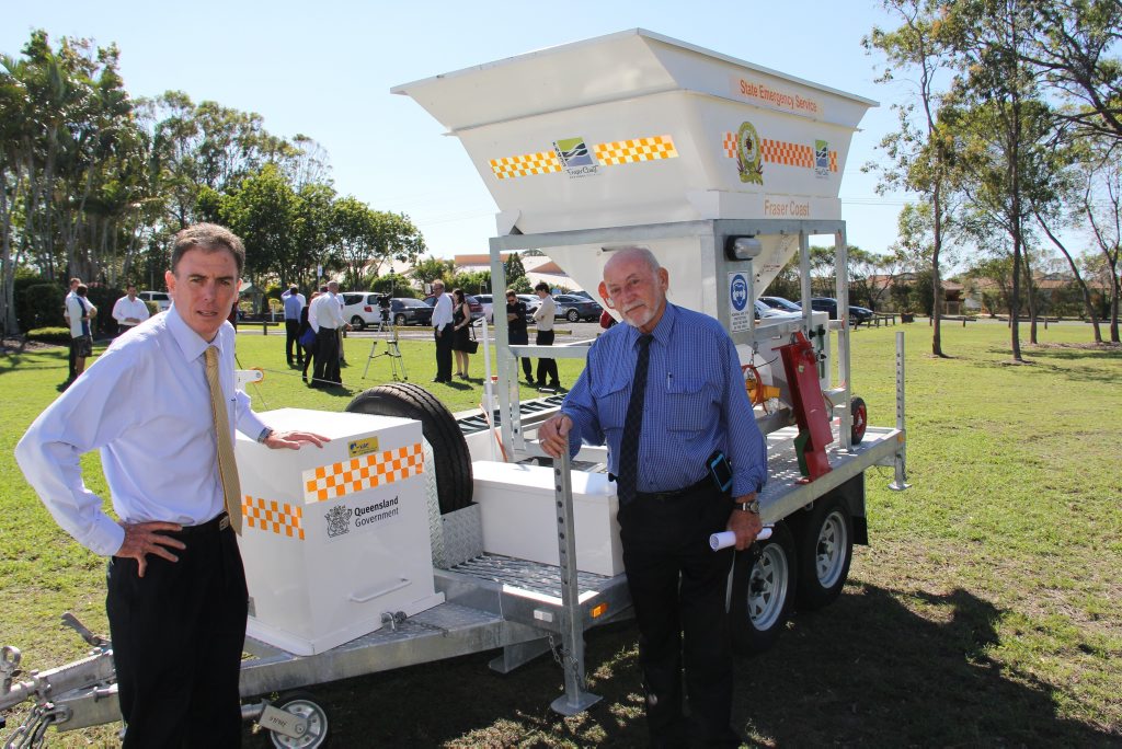 Fraser Coast Mayor Gerard O'Connell and disaster planning co-ordinator Mal Chruchill with the council's new sand bagging machine. Fraser Coast Mayor Gerard O'Connell and disaster planning co-ordinator Mal Chruchill with the council's new sand bagging machine.
