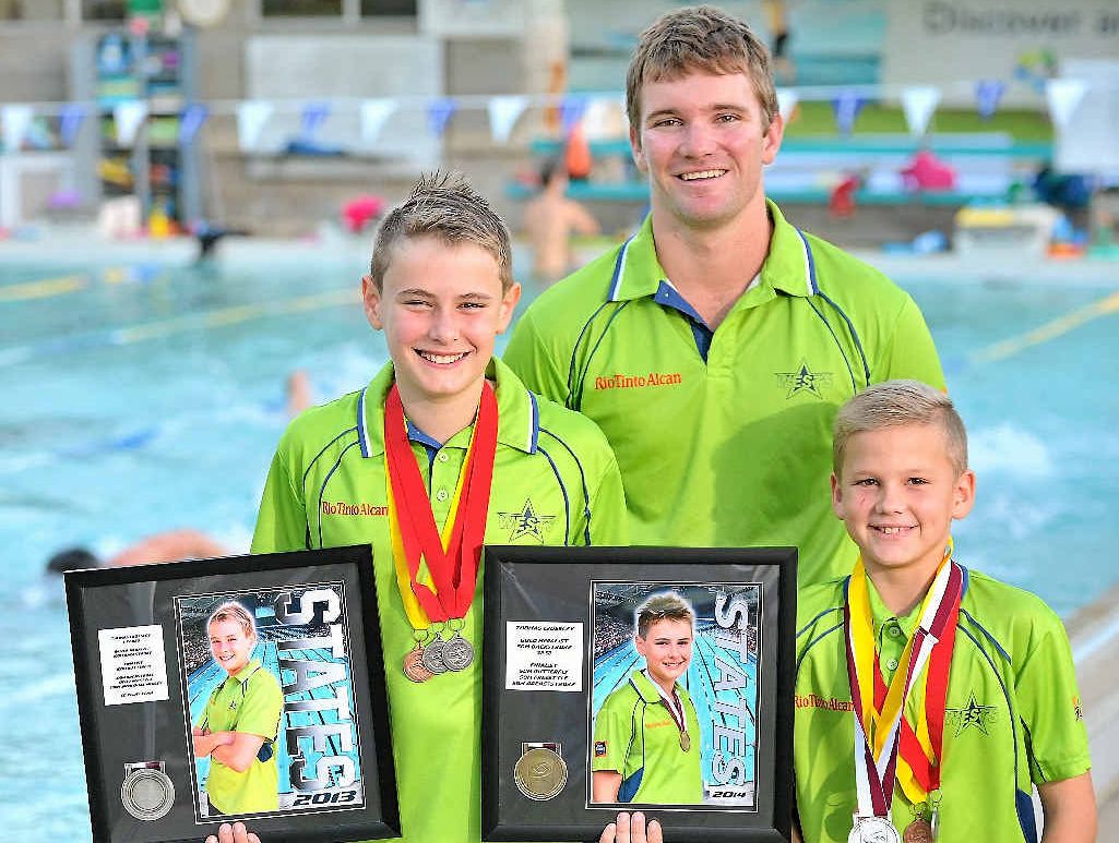 Thomas Crossley, 11, coach Adam Eiseman and Jai Hansen, 10. Thomas Crossley, 11, coach Adam Eiseman and Jai Hansen, 10.
