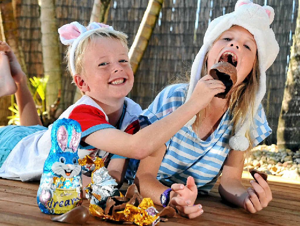 Gypsy McCormack, 8, and brother Ryder, 5, of Mountain Creek, tuck into a chocolate Easter egg, but experts are warning not to eat too much. Gypsy McCormack, 8, and brother Ryder, 5, of Mountain Creek, tuck into a chocolate Easter egg, but experts are warning not to eat too much.