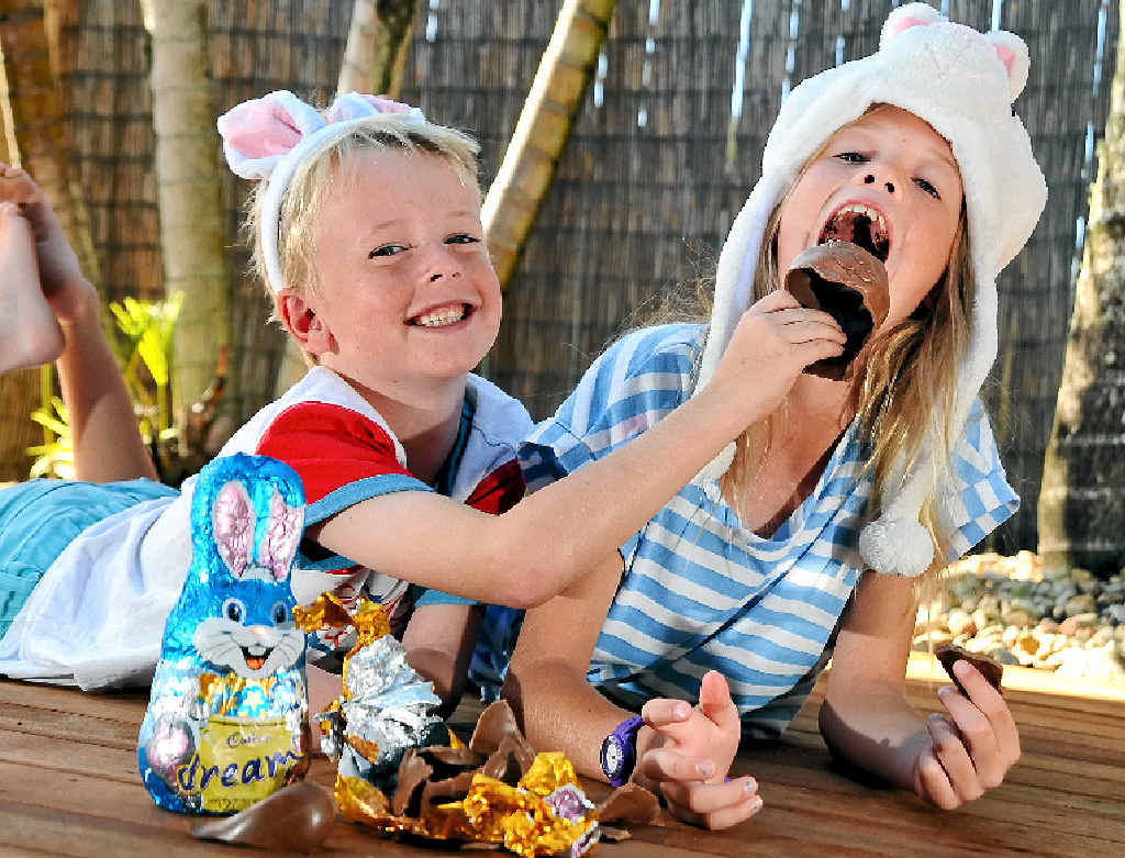 Gypsy McCormack, 8, and brother Ryder, 5, of Mountain Creek, tuck into a chocolate Easter egg, but experts are warning not to eat too much. Gypsy McCormack, 8, and brother Ryder, 5, of Mountain Creek, tuck into a chocolate Easter egg, but experts are warning not to eat too much.