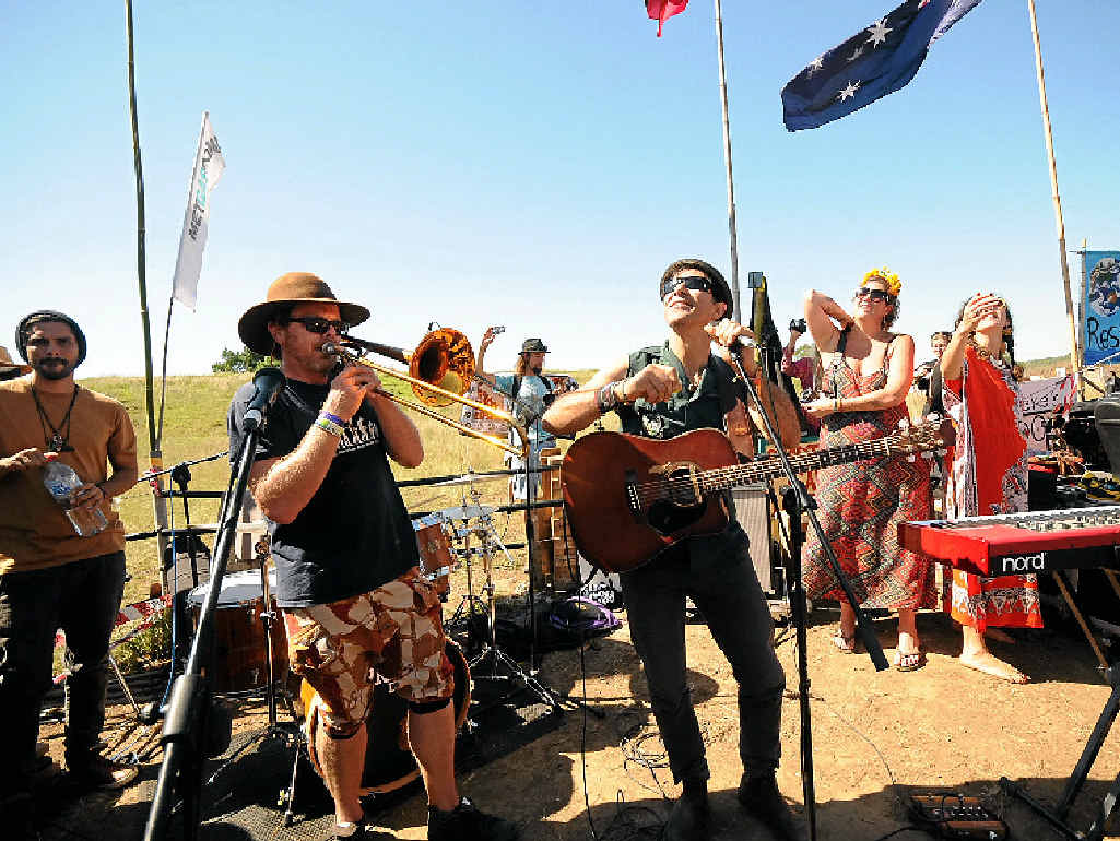 STANDING TOGETHER: Nahko and Medicine For the People perform at the Bentley protest site in Lismore yesterday. STANDING TOGETHER: Nahko and Medicine For the People perform at the Bentley protest site in Lismore yesterday.