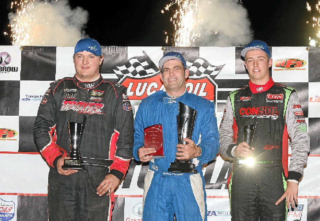 VICTORY: Title winner Andrew Pezzutti (centre) celebrates after claiming top spot in the latest V8 Dirt Modified Championship at Lismore ahead of runner-up Kevin Britten (left) and Mitchell Gee, who took third.