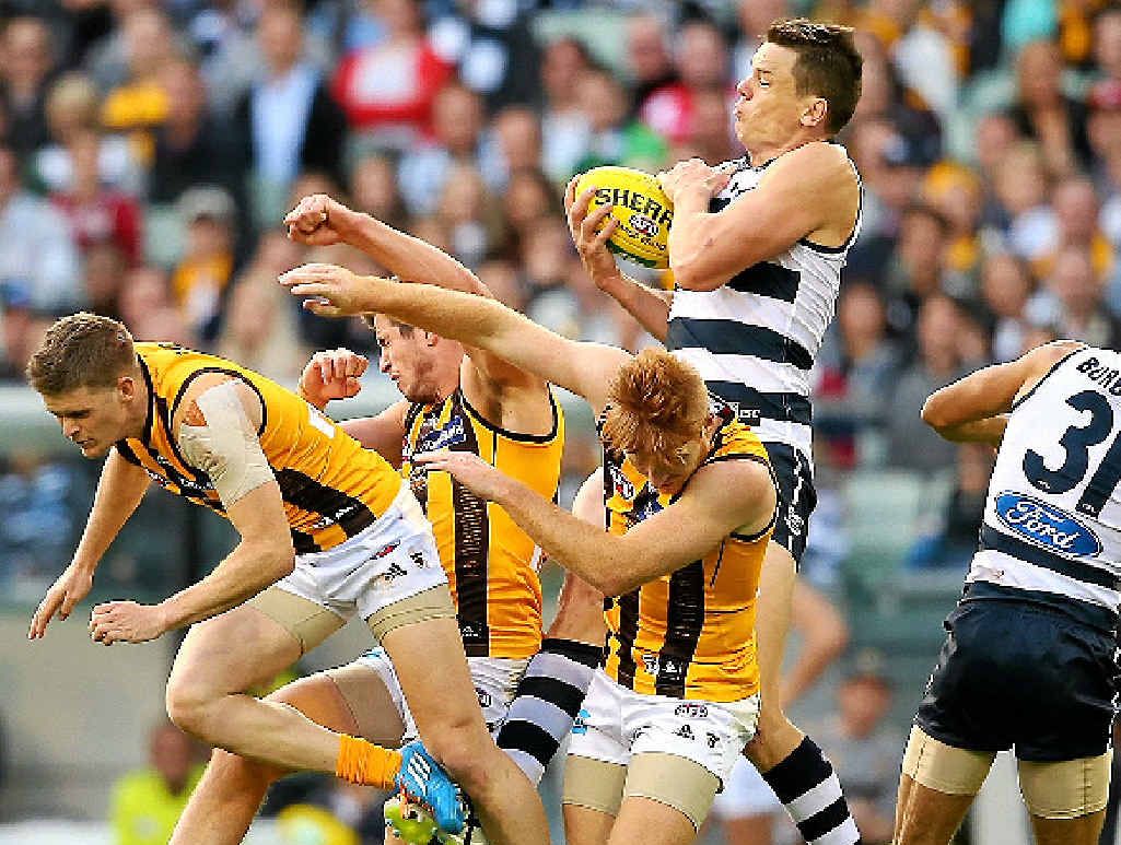 Hamish McIntosh of the Cats marks in amongst a pack of Hawthorn players at the MCG yesterday. Hamish McIntosh of the Cats marks in amongst a pack of Hawthorn players at the MCG yesterday.