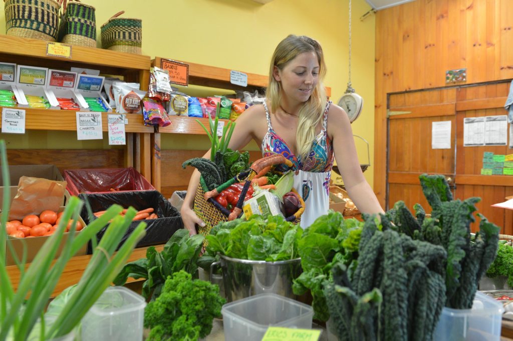 Vegetarian Amy Joyce looking over fresh produce. Vegetarian Amy Joyce looking over fresh produce.