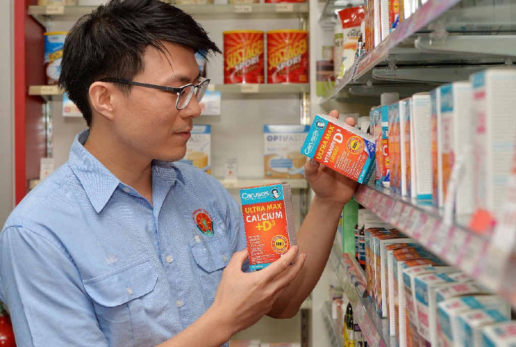 Sydney St’s Red Apple Chemist pharmacist Mike Yang says those seeking a vitamin D supplement should get one with calcium to help the body absorb calcium more effectively. Sydney St’s Red Apple Chemist pharmacist Mike Yang says those seeking a vitamin D supplement should get one with calcium to help the body absorb calcium more effectively.