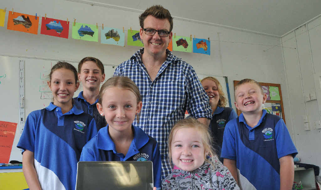 Buliyan State School’s (back) Dani Pemen, 12, Asiah Mooney, 11, teaching principal Will Ashburn, Jesse Coogan, 11, Coby Hudson, 9, (front) Chloe Keitley, 8, and Emma-Jean Manley, 6, with one of the iPads the school won in The Observer’s iPads for Schools competition. Buliyan State School’s (back) Dani Pemen, 12, Asiah Mooney, 11, teaching principal Will Ashburn, Jesse Coogan, 11, Coby Hudson, 9, (front) Chloe Keitley, 8, and Emma-Jean Manley, 6, with one of the iPads the school won in The Observer’s iPads for Schools competition.