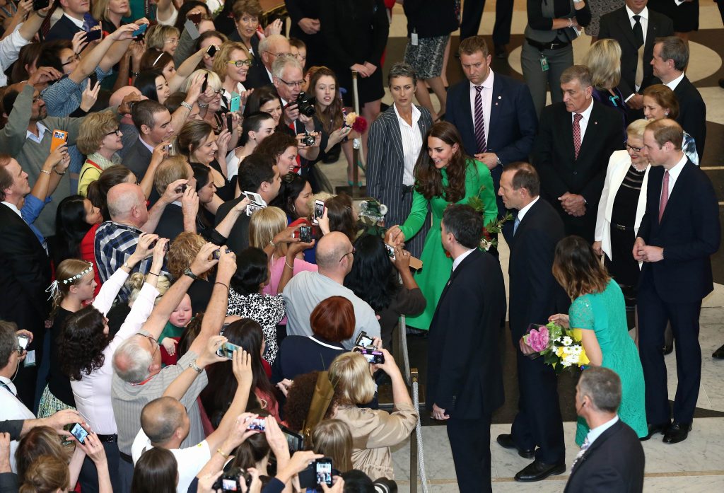 Catherine, the Duchess of Cambridge , accompanied by Australia's Prime Minister Tony Abbott (centre R), greets members of the public as her husband Britain's Prince William (far R) looks on, upon their departure from a reception hosted by Abbott at Parliament House in Canberra on April 24, 2014. Catherine, the Duchess of Cambridge , accompanied by Australia's Prime Minister Tony Abbott (centre R), greets members of the public as her husband Britain's Prince William (far R) looks on, upon their departure from a reception hosted by Abbott at Parliament House in Canberra on April 24, 2014.