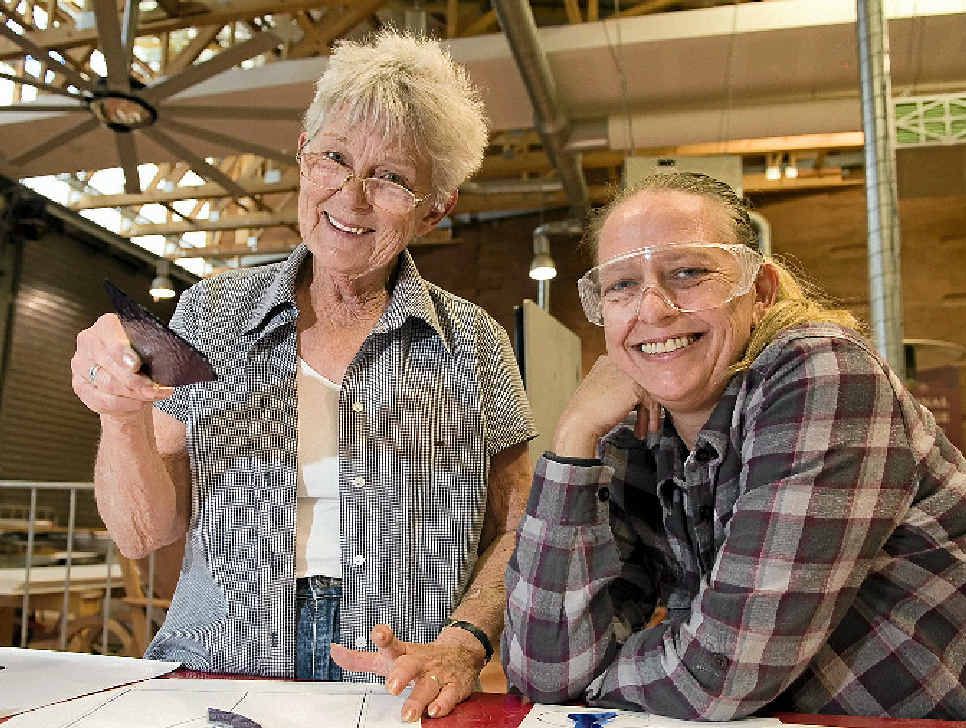 CRAFTY CLASS: Lyn Swan (left) instructs Joanne Barnes during a glass art lead lighting workshop.