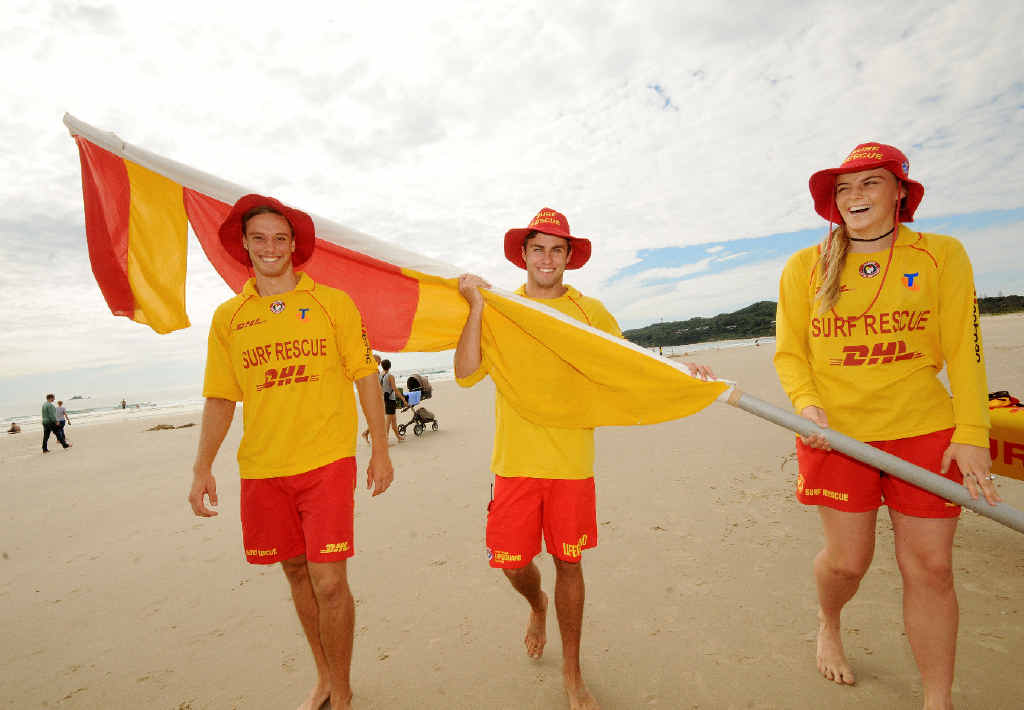 ALL DONE: Jake Brumley, Tom Burns, and Connor Moriarty from the Byron Bay surf life saving club, pull up the flag’s at the end of the surf life saving season. ALL DONE: Jake Brumley, Tom Burns, and Connor Moriarty from the Byron Bay surf life saving club, pull up the flag’s at the end of the surf life saving season.