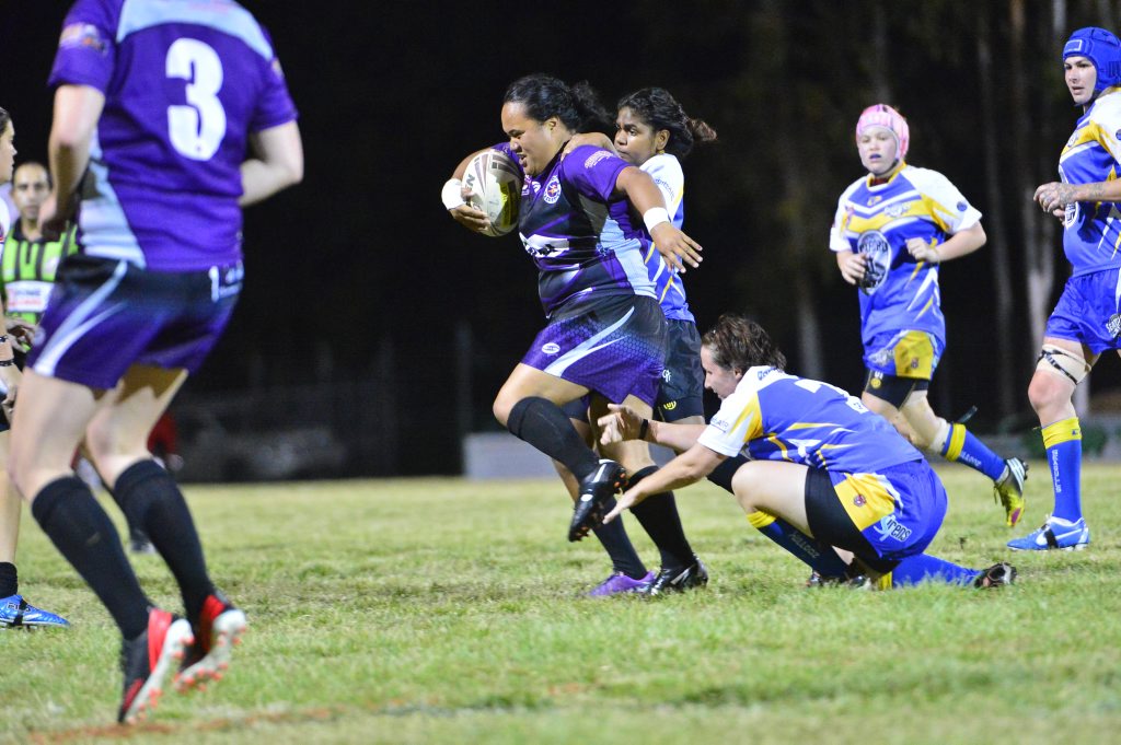 TAKING OFF: Raidettes’ Martha Wherewera with the ball in the women’s rugby league grand final against Yeppoon. TAKING OFF: Raidettes’ Martha Wherewera with the ball in the women’s rugby league grand final against Yeppoon.