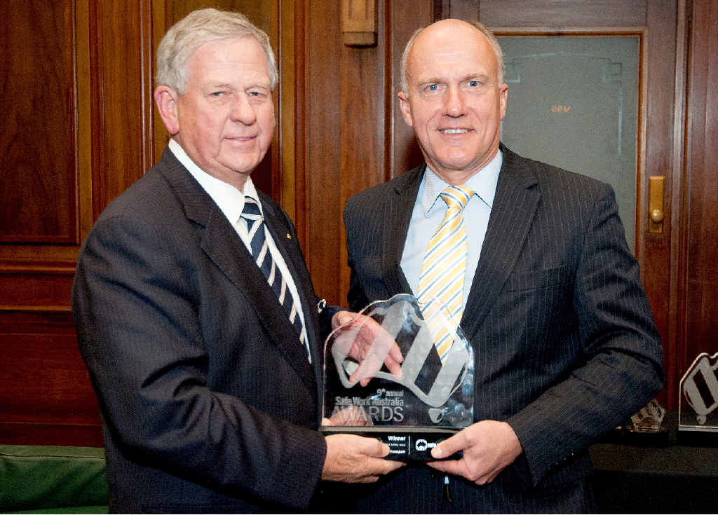 HIGH HONOUR: Ross Fraser from Frasers Livestock Transport accepts the Safe Work Australia award from Senator Eric Abetz at a ceremony in Canberra Monday night. HIGH HONOUR: Ross Fraser from Frasers Livestock Transport accepts the Safe Work Australia award from Senator Eric Abetz at a ceremony in Canberra Monday night.