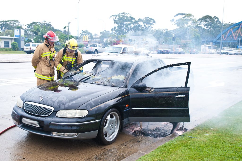 A dual cab Holden ute catches fire outside Park Beach HomeBase. Photo: Rob Wright / The Coffs Coast Advocate A dual cab Holden ute catches fire outside Park Beach HomeBase. Photo: Rob Wright / The Coffs Coast Advocate