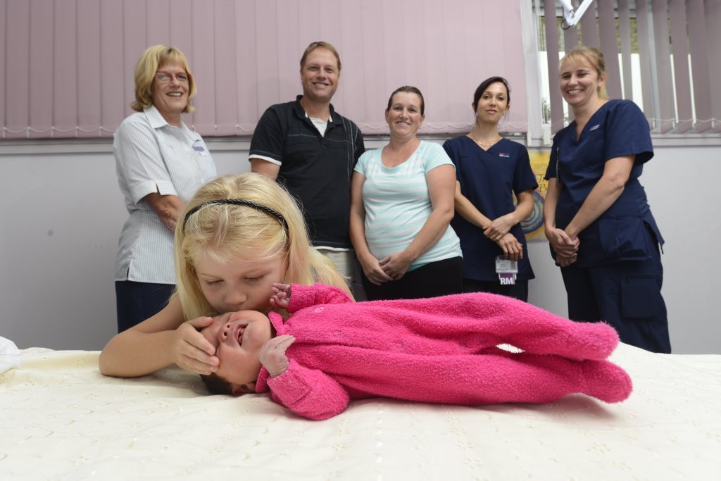 Isabelle Croft, 4 gives her new baby sister Mackenzie Croft a kiss after she was born in the new birthing suite at Grafton Base Hospital. In the background is Nursing Unit Manager of Maternity Angie Garland, Parents Daniel and Garbrielle Croft of Yamba, Midwife Melanie McLennan and student midwfie Lynne Blundell. Photo Adam Hourigan / The Daily Examiner Isabelle Croft, 4 gives her new baby sister Mackenzie Croft a kiss after she was born in the new birthing suite at Grafton Base Hospital. In the background is Nursing Unit Manager of Maternity Angie Garland, Parents Daniel and Garbrielle Croft of Yamba, Midwife Melanie McLennan and student midwfie Lynne Blundell. Photo Adam Hourigan / The Daily Examiner