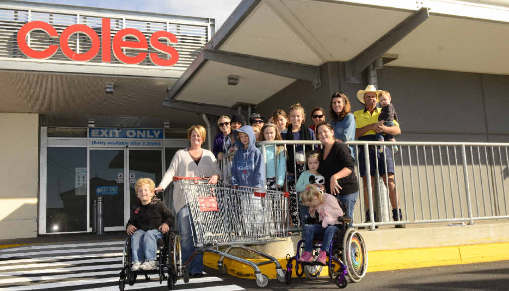 WORTH THE WAIT: Patricia Verran and her son Bailey (left) and friends Jess White and others who supported the call in getting a new special shopping trolley in Coles Yamba. Photo Debrah Novak WORTH THE WAIT: Patricia Verran and her son Bailey (left) and friends Jess White and others who supported the call in getting a new special shopping trolley in Coles Yamba. Photo Debrah Novak