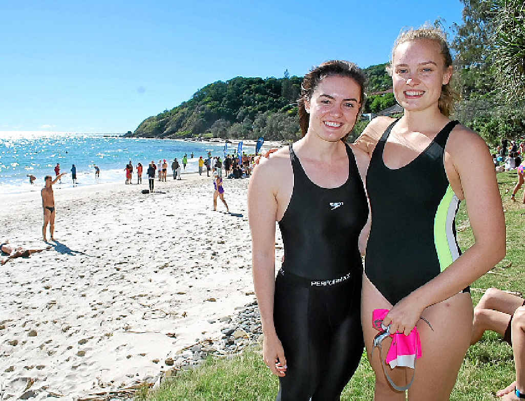 Sisters Clare and Amanda Sewell from Byron Bay SLSC catch the sun before Sunday’s big race. Sisters Clare and Amanda Sewell from Byron Bay SLSC catch the sun before Sunday’s big race.