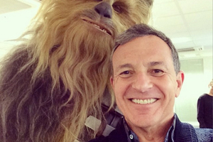 Disney chairman Bob Iger posing with Chewbacca Disney chairman Bob Iger posing with Chewbacca