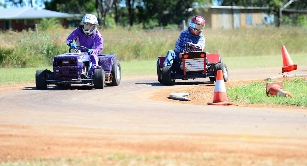 ROUND THE BEND: Ken Booy and Russell Smith battle it out around the bend in heat one of the A-grade at the Queensland Ride-On Mower Championships at Yaamba. ROUND THE BEND: Ken Booy and Russell Smith battle it out around the bend in heat one of the A-grade at the Queensland Ride-On Mower Championships at Yaamba.