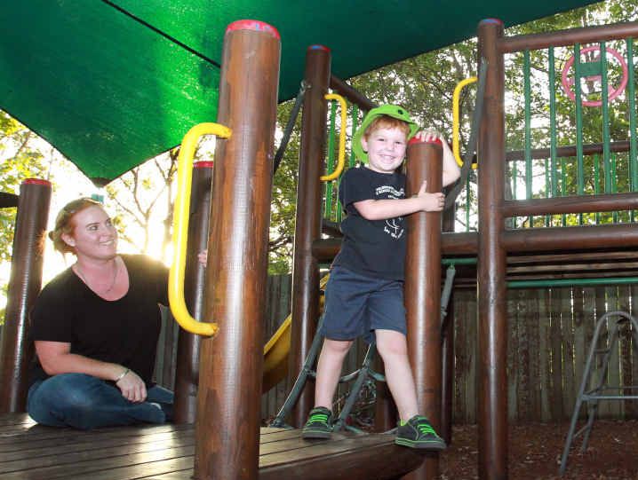 SAFE PLAY: C & K Palmwoods Community Kindergarten committee president Megan Crowhurst and her children Rhys, 4, and Perry, 2, are happy that Naskam Security Services has donated security cameras after broken glass was found in the playground.
