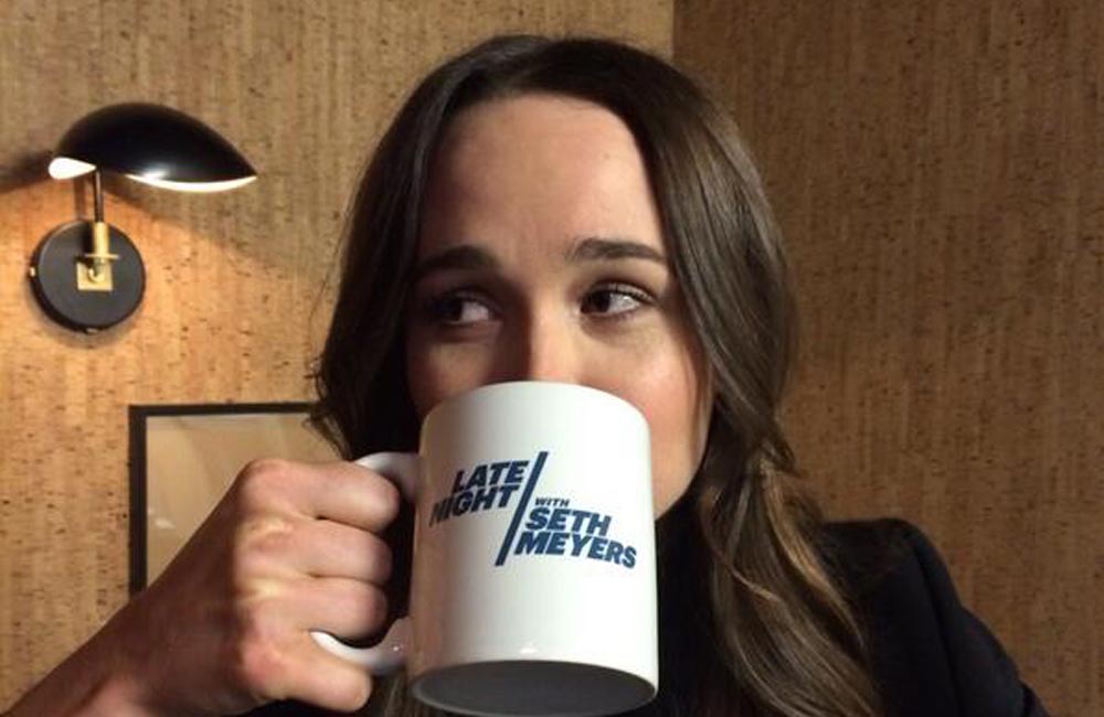 Ellen Page sipping from her Late Night with Seth Meyers mug Ellen Page sipping from her Late Night with Seth Meyers mug