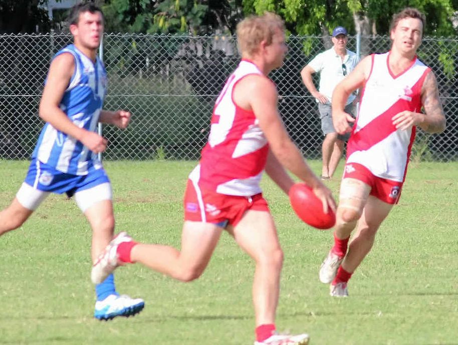 OVERPOWERING: Sam Nicholls and Cam Watkin show their style during the Swans win over Rockhampton Brothers Kangaroos at Kele Park last weekend.