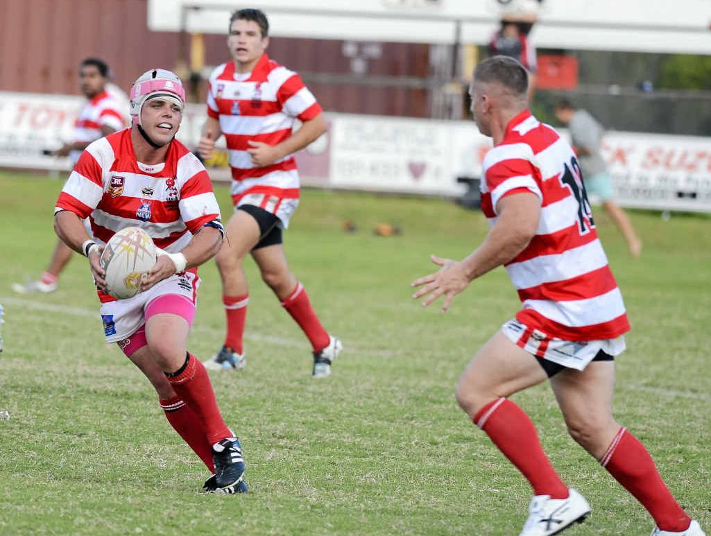 VALIANT DISPLAY: Rhys Walters offloads as the scoreboard shows victory within reach for Rebels. PHOTO: DEBRAH NOVAK VALIANT DISPLAY: Rhys Walters offloads as the scoreboard shows victory within reach for Rebels. PHOTO: DEBRAH NOVAK